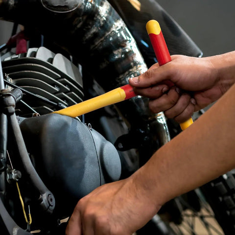 Hardcore 16-Piece Insulated Socket Set With 1000V Safety Rating being used on a motorcycle engine for electrical repairs.