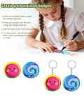 Child drawing on paper with All In One Button And Keychain Making Kit With 100 Button Backs 20 Keychain Bases 120 Blank Papers And 120 Clear Film Sheets Ideal For DIY Pins And Custom Accessories components.
