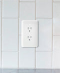 Paintable Masque 2000 1-Gang Decorator Wall Plate With Grounded Duplex Outlet Cover For White Finish against tiled wall