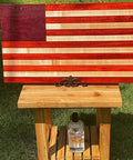 American flag design cutting board on stand, with Heavy-Duty Go-To Butcher Block Conditioner And Cutting Board Oil, 12 oz bottle below.