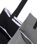 Close-up of 2 Pack Large Wet Dry Bag For Cloth Diapers Waterproof Hanging Organizer With Double Zippered Pockets in black and grey.