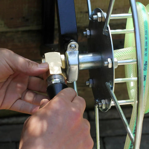 Brass Garden Hose Reel Swivel Elbow Connector Replacement Part Three Quarter Inch GHT To One Half Inch Rustproof Fittings With Washers Sealing Ring And Tape For Leak Free Built To Last Hose Reel Assembly, attached to hose reel