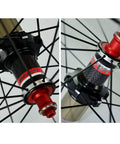Close-up of 700C Road Wheelset With Front 100mm And Rear 130mm Quick Release Hubs 30mm Deep Aluminum Rim Carbon Blend Build Sealed Bearings