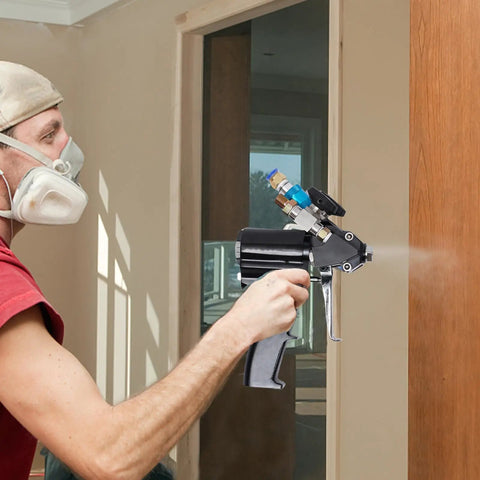 Person using Heavy Duty PU Foam Spray Gun Featuring Slick Pneumatic Trigger And Self Cleaning Design for wall cavity foaming.