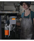 Pro Grade Magnetic Drill Press Variable Speed Bench Drilling Machine Built Like A Tank, shown in use with a drill bit.