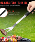 Person using long grill fork from Stainless Steel BBQ Grill Tools Set For Outdoor Grilling Includes Tong Spatula Fork Knife Basting Brush Six Skewers And Gift Box A Complete Barbecue Utensil Kit For Men Fathers Day Christmas And Thanksgiving
