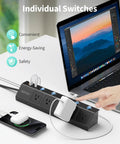 Flat Plug Power Strip With Individual Switches, Ultra Thin 10 Ft Extension Cord, 5 Outlets Plus 2 USB-C 20W PD And 2 USB-A next to a laptop