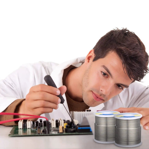 Man soldering circuit board with Two Pack Sn60 Pb40 Rosin Core Solder Wire For Electrical Soldering And Home DIY 2 mm Diameter 500 G Total Easy Melt For Electronics Repairs Quick Fixes And Handy Soldering Mastery.