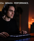 Gamer using SN7100 1TB NVMe SSD Gen4 PCIe M2 2280 Up To 7250 MBps for fast gaming performance at a desk.