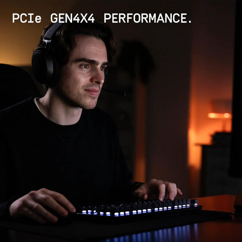 Gamer using SN7100 1TB NVMe SSD Gen4 PCIe M2 2280 Up To 7250 MBps for fast gaming performance at a desk.