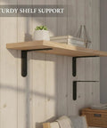 Tough As Nails Black L Shaped Shelf Bracket Stainless Steel Wall Mount For Floating Shelves supporting a wooden shelf
