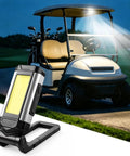 Hella Bright Magnetic Rechargeable Golf Cart Led Dome Light With 360 Spin And Seven Glowing Modes illuminating a golf cart at night.