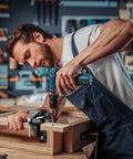 Person using a Cool Mini Table Vise With Adjustable Clamp Jaw for woodworking, featuring a drill and precision assembly.