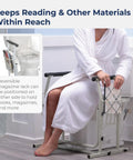 Toilet Safety Frame With Freestanding Grab Bar For Bathroom, Sturdy Aluminum Rail, woman sitting with magazine rack, white.
