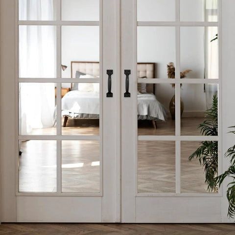 Four Point Seven Inch Iron Gate And Door Handle Set Black on glass doors, hardwood floor visible