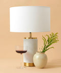 Arden LED Table Lamp With USB Port Charge Your Phone Or Tablet Beside a Vase and Wine Glass, Marble Finish and Lampshade
