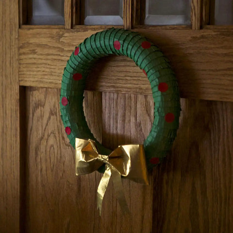 Metallic Gold Duct Tape Roll 1.88 Inch by 10 Yards for Repairs and Crafts wreath with gold bow on a wooden door