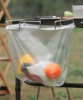 Desktop Trash Can Holder And Hanging Rack Organizer For Home And Camping with filled plastic bag on a table edge