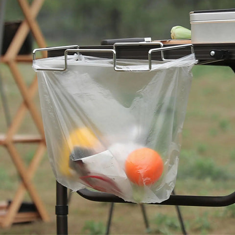 Desktop Trash Can Holder And Hanging Rack Organizer For Home And Camping with filled plastic bag on a table edge