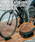 Front Wheel Riser Trainer Block With Anti Slip Design For Indoor Bike Training Fits Stationary Mountain And Road Bikes Natural Riding Position Setup For Home Gym Rides in use