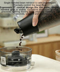 Smart Electric Vacuum Coffee Canister With Bright Digital Screen And Handy Timer To Lock In Dang Fresh Bean Flavor While Keeping Trail Mix And Loose Leaf Tea Hella Crisp, pouring coffee beans.