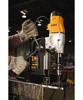 Heavy Duty Magnetic Drill Press With Dual Speed Gears And Rapid Change Chuck System Powered By A Rugged Ten Amp Motor in action on metal.