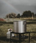 Seafood Boil Kit With Propane Burner And Regulator, 60 Quart Pot With Basket, Heavy Duty Outdoor Crab Boil Pot on grass.