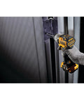 User operating the Compact 12V Max Cordless Impact Driver Kit Featuring A Brushless Build and Quarter Inch Quick Swap Chuck.