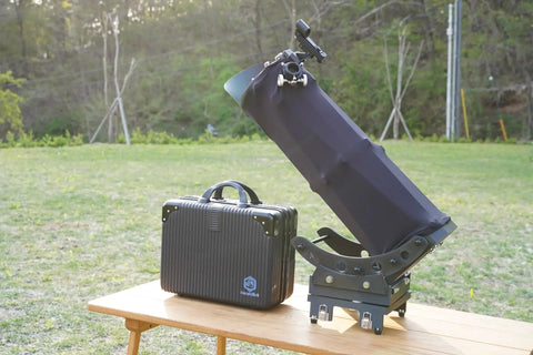 Ultra Light 6 Inch Portable Dobsonian Telescope for Travel with case on table, ready for stargazing outdoors.
