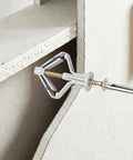 Illustration of Heavy Duty Drywall Anchor Kit With 30 Self Tapping Screws for Hollow Walls, showing butterfly expansion in gypsum board.