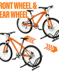 Push In Floor Bike Stand For 16 To 29 Inch Bikes No Lift Needed Easy Roll In Garage Parking Rack holding orange bikes