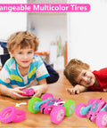 Two children playing with a Pink Remote Control Car For Girls That Flips 360 Degrees, featuring changeable multicolor tires.