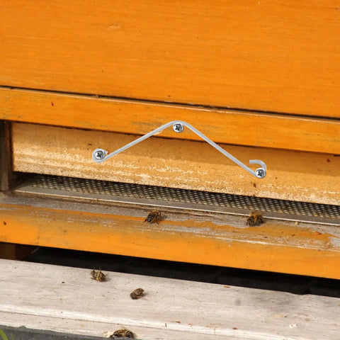 Get Your Bees Buzzing With These Sturdy 10 Pc Beehive Frame Spring Clamps And Curved Clips For Easy Beekeeping Tool Kit Setup And Fastener Jobs. Silver metal beehive frame clamp on wooden hive entrance