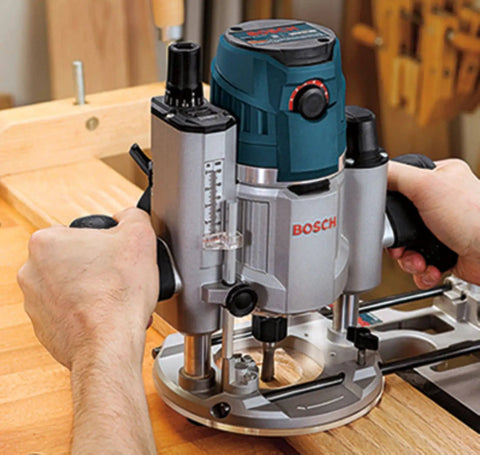 Person using a router on wood, related to RBS006TES 6 Piece Carbide Tipped Trim and Edging Router Bit Set For Fine Finishing In Soft And Hard Wood And Wood Composites Micrograin Carbide Tips Deliver Precise Edges And Lasting Durability.