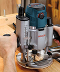Person using Versatile 30 Piece Carbide Tipped Wood Router Bit Set For Hardwood Softwood And Wood Composite Projects Pro Grade Finishing