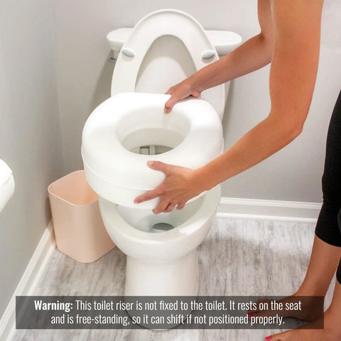 5 Inch Elevated Toilet Seat Riser For Seniors With Round Bowl Slip Resistant Pads being placed on toilet