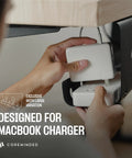 Under Desk Cable Management Tray 2 Pack installed holding a MacBook charger under a desk, strong adhesive securing cable organizer.
