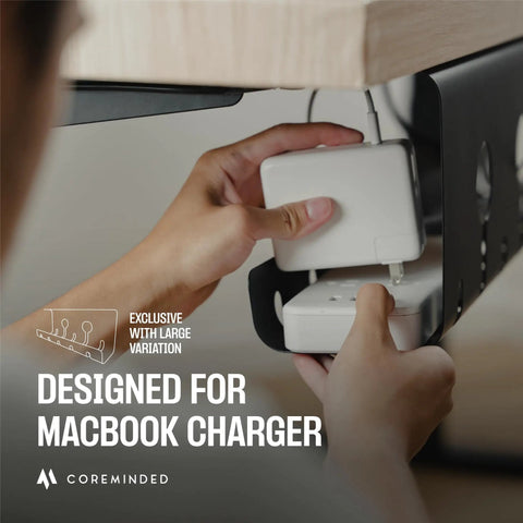Under Desk Cable Management Tray 2 Pack installed holding a MacBook charger under a desk, strong adhesive securing cable organizer.
