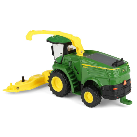 One Sixty Fourth Scale Farm Harvester Toy with swiveling spout, yellow plastic forage head, metal frame, realistic five inch length model.
