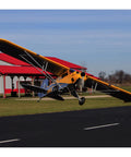 Carbon Cub 15cc ARF Ready To Fly RC Plane With Laser Cut All Wood Construction landing at field with tundra style wheels