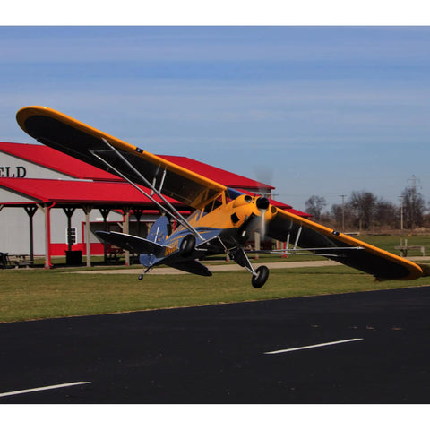 Carbon Cub 15cc ARF Ready To Fly RC Plane With Laser Cut All Wood Construction landing at field with tundra style wheels