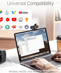 Sharp 1080P Hd Webcam With Noise Canceling Mic And Auto Light Correction Featuring Privacy Cover Wide Angle View Simple USB Plug And Play Ready For Laptop Desktop PC Mac shown on a MacBook with coffee cup and camera.