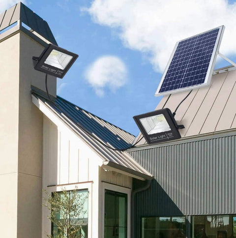 JUDYSSY Solar Flood Lights Solar Led Flood Lights installed on a roof with solar panel, showing dual head setup for outdoor use.
