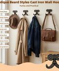 Heavy Duty Kickass Cast Iron Mustache Wall Hooks holding bags and coats on a wall, showcasing beard-shaped coat racks for home use.
