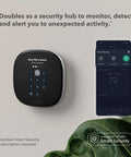 Smart Thermostat Enhanced with WiFi and Voice Control on wall, displayed with smartphone app interface for security monitoring.