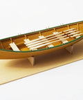 Shipwright Series 3 Kits Trio With Tools For Adults wooden Fisherman's Dory model on display stand.