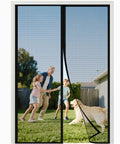 Family playing outdoors behind Upgraded Magnetic Screen Door Closure For 72 By 80 Inch Doors Reinforced Fiberglass Double Mesh Curtain