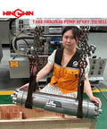 Front view of a stainless steel waterjet intensifier pump labeled WIN-GWIN, suspended by chains