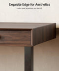 Close-up of Classic Mid Century Modern Electric Standing Desk 63 Inch showing walnut finish edge and drawer.
