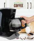 Front view of black Mr. Coffee coffee maker with glass 12-cup replacement carafe and black handle